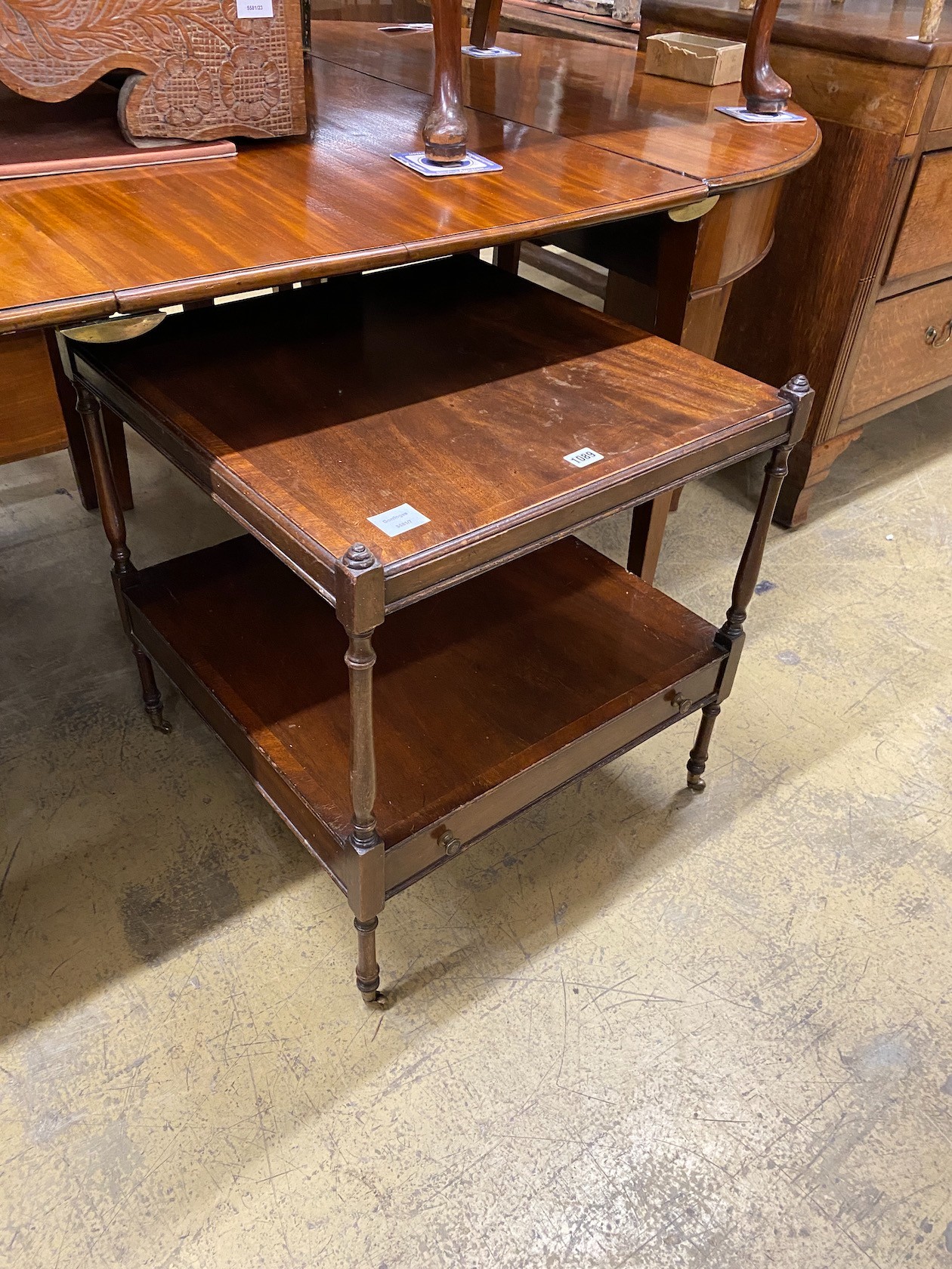 A pair of reproduction George III style mahogany two tier tables, width 56cm, height 60cm